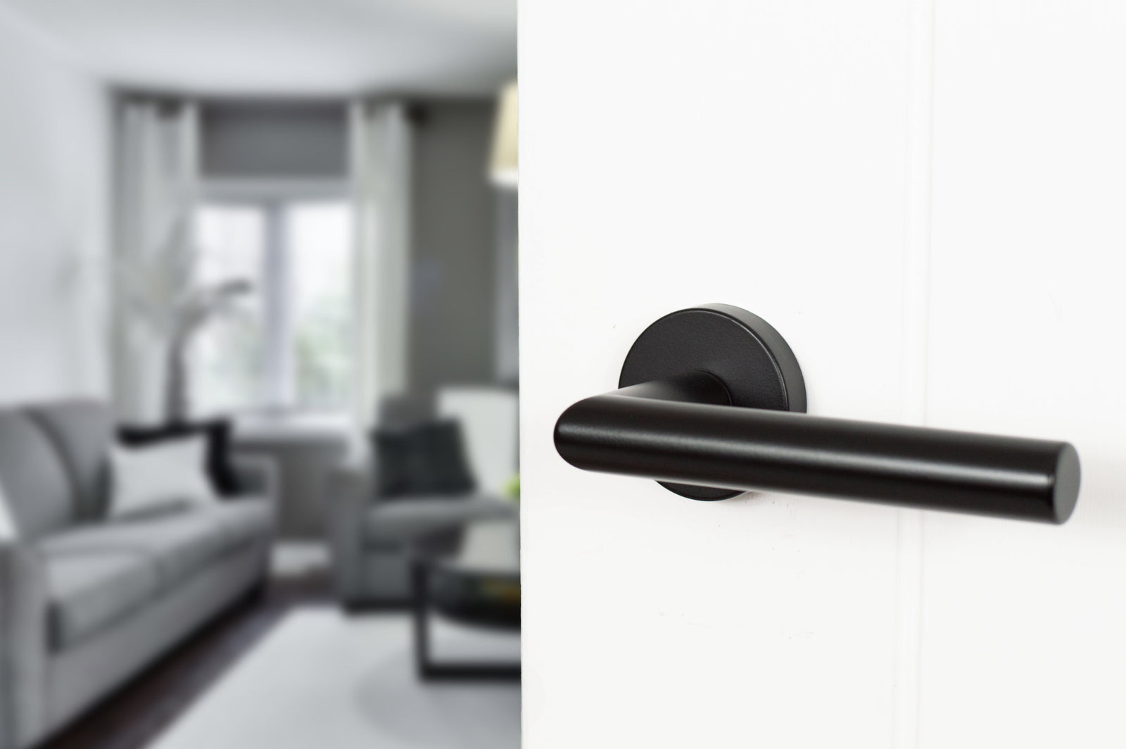 Forme Elle Designer Lever Minimal Round Rose in Matt Black Designer Lever Handle Atlantic