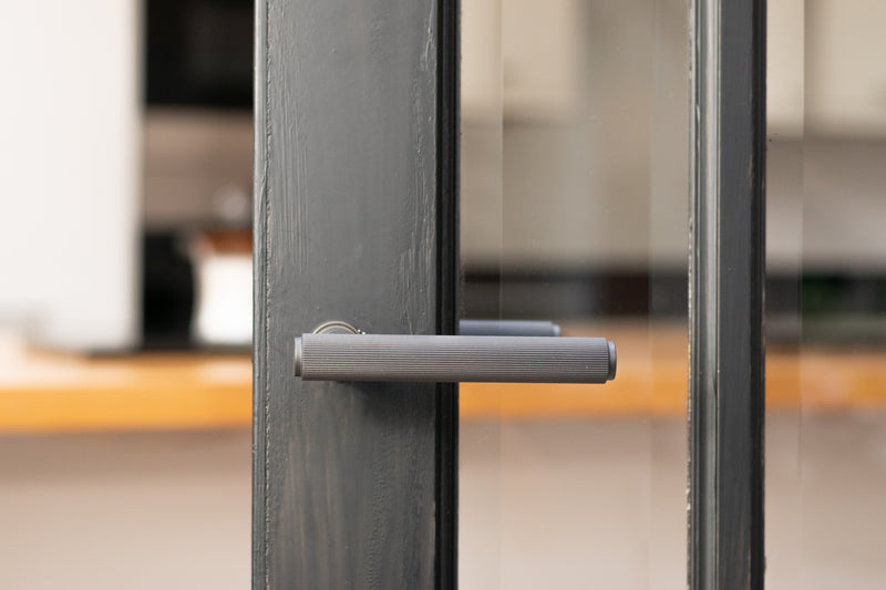 Millhouse Brass Stephenson Lever Door Handle on Concealed Round Rose in Matt Black