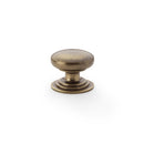 Waltz Round Cupboard Knob on Stepped Rose 32mm Cupboard Knob Alexander & Wilks Antique Brass 