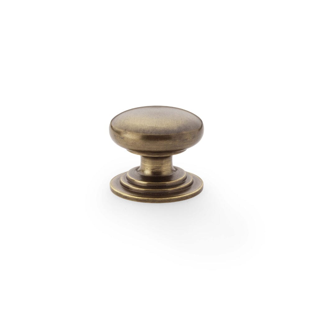 Waltz Round Cupboard Knob on Stepped Rose 32mm Cupboard Knob Alexander & Wilks Antique Brass 