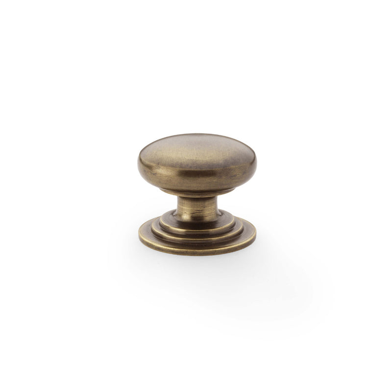 Waltz Round Cupboard Knob on Stepped Rose 32mm Antique Brass AW825-32-AB