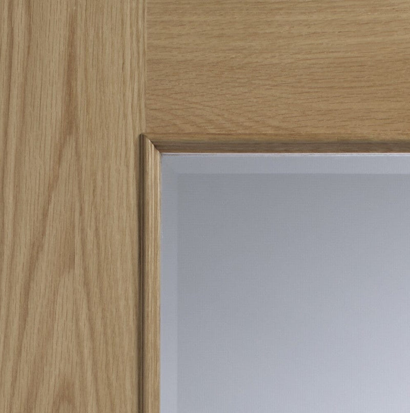 Andria Internal Oak Door with Clear Bevelled Glass and Raised Mouldings