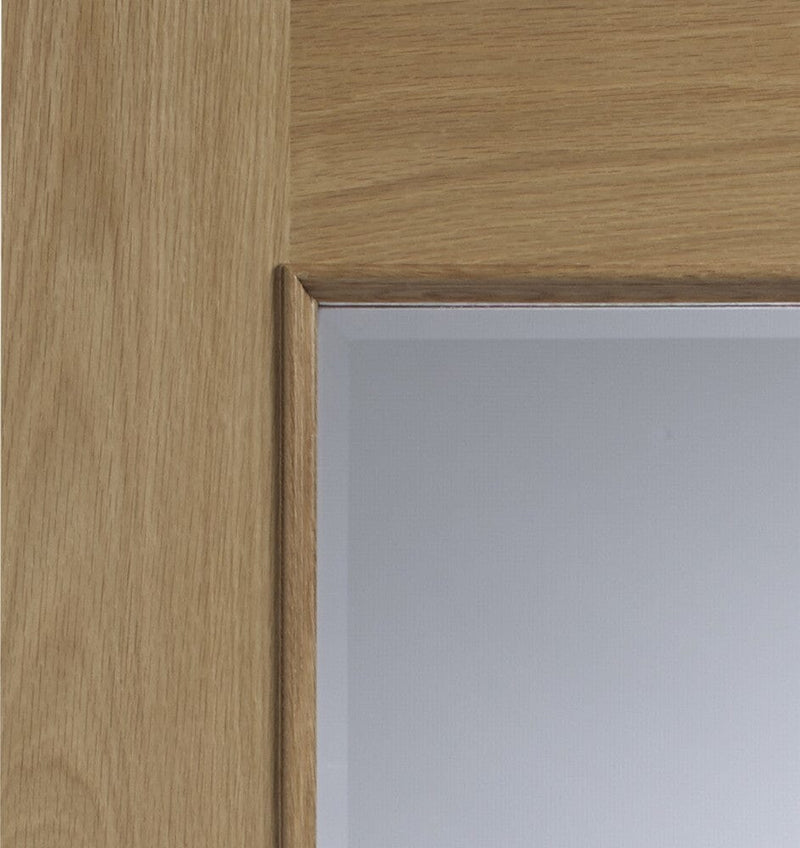 Calabria Internal Oak Door with Clear Bevelled Glass and Raised Mouldings