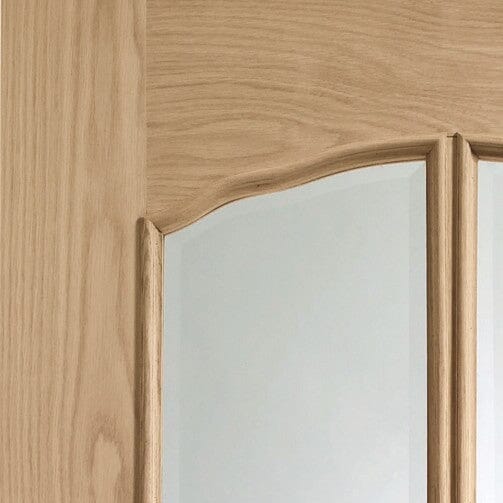 Riviera Internal Oak Door With Raised Mouldings and Clear Bevelled Glass